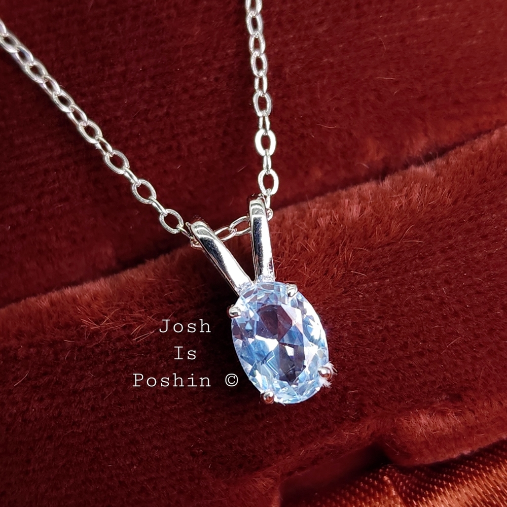 Oval sky blue topaz pendant necklace in sterling silver